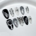 GLORS Gothic Long Almond Press-On Nails – Black & Silver with Butterfly Accent